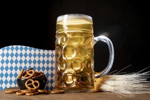 Bavarian beer on a table with pretzels