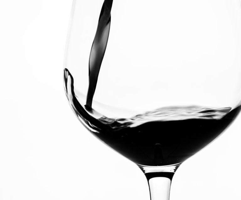 Red wine being poured into a glass