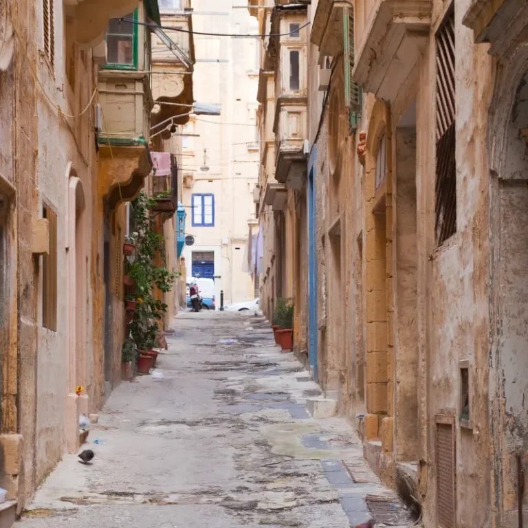 Old street with balconies in Valletta, Malta