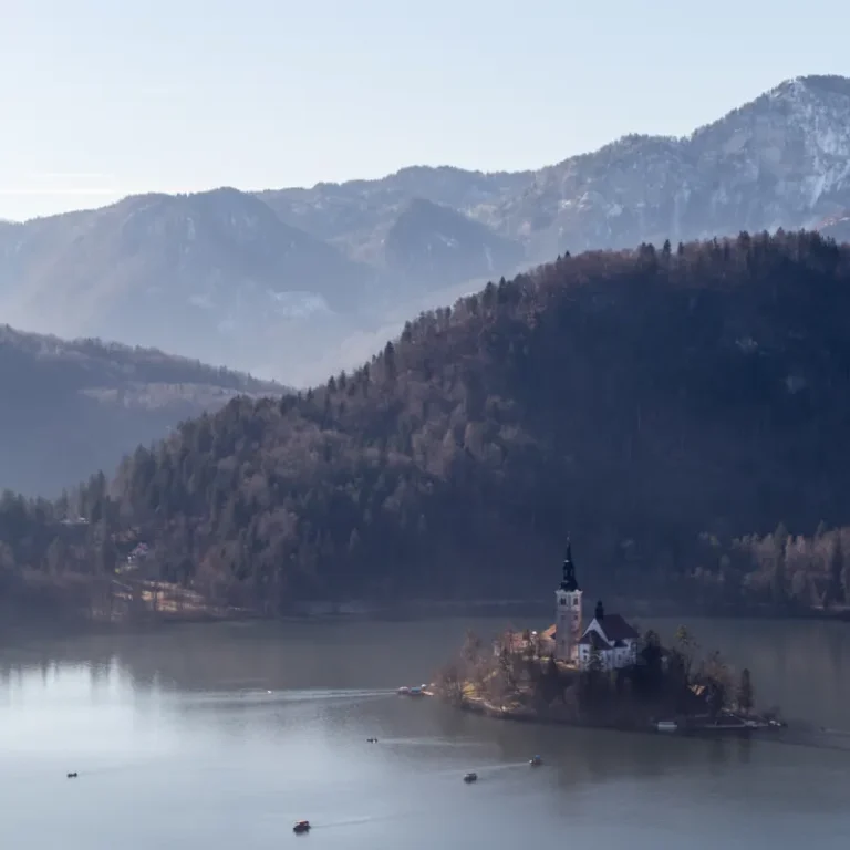 Lake Bled island church beneath the Julian Alps