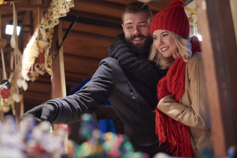 Visitors browsing the stalls at a Christmas market