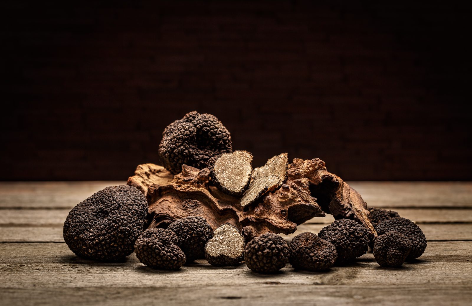 Black truffles on a rustic wooden table, Umbria