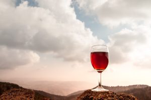 A glass of red wine in the autumn hills