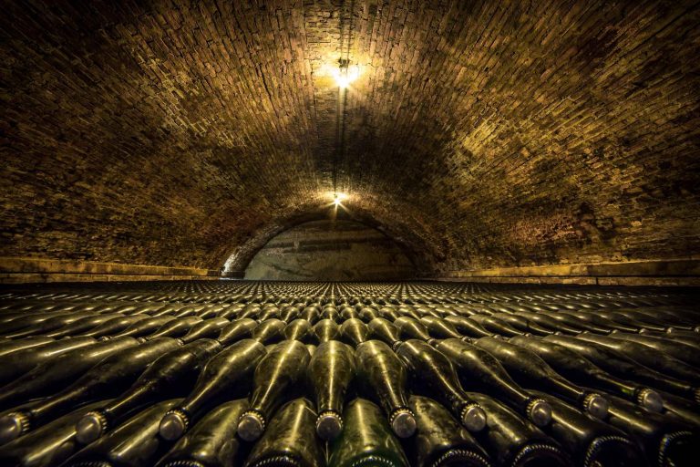 Wine bottles in a cellar tunnel, Vouvray