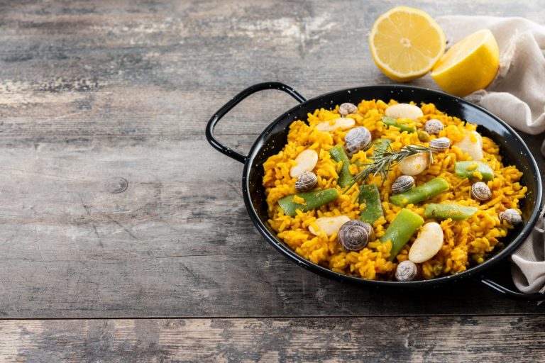 Traditional paella valenciana with rabbit, chicken and garrofo beans
